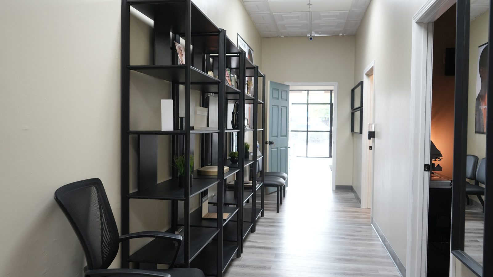 The hallway connecting the showroom to the exam and dispensing rooms.