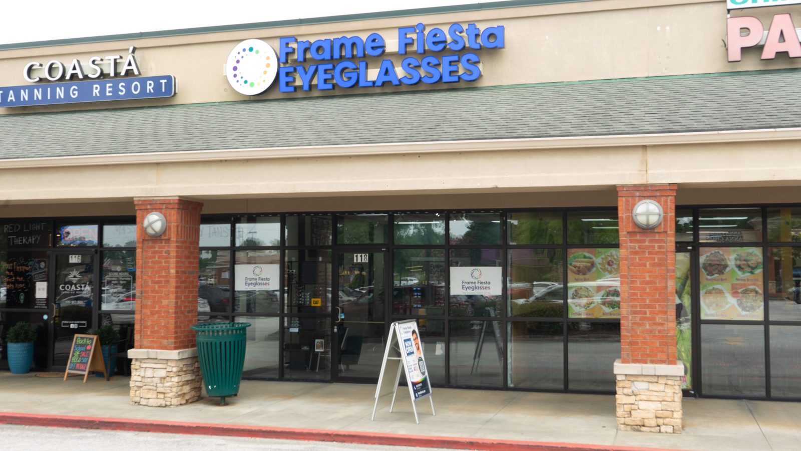 The Frame Fiesta Eyeglasses storefront at 8876 Dallas Acworth Hwy., Suite 118 in Dallas, Georgia.